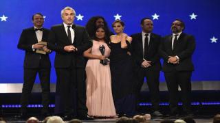 Roma director Alfonso Cuaron and some of the film's cast